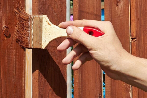 using a paintbrush is just one of the things you'll learn in our how to paint a fence guide