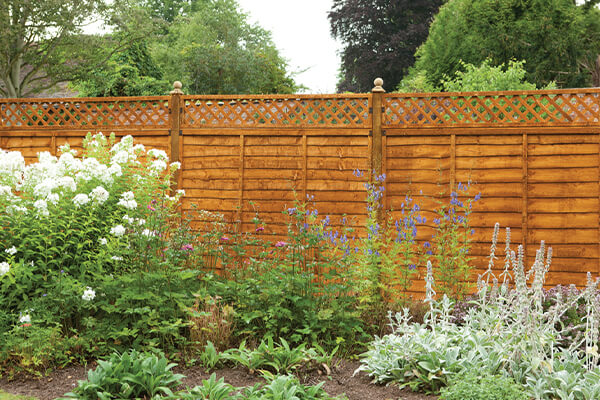 a run of fencing with a fence topper - one of our fence extension ideas