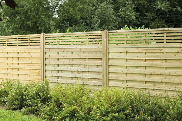 a run of decorative pressure treated fence panels - one of our garden fencing ideas