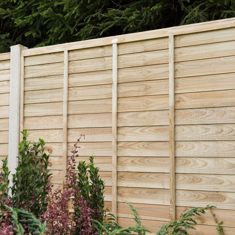 a pressure treated fence panel - one of our pet-friendly fences