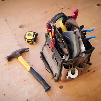 a bag of tools that you'll need when learning how to install a fence post