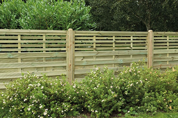 Decorative fence panel with trellis topper