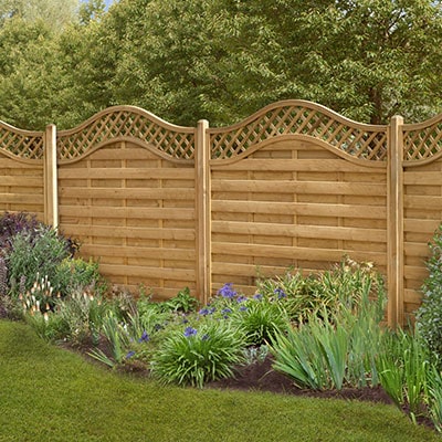 decorative fencing combining hit and miss, lattice, and wavey top designs