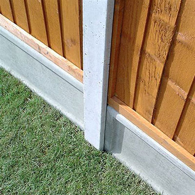 concrete fence posts and gravel boards, supporting wooden fence panels
