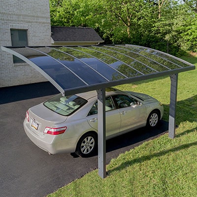 a modern metal carport with polycarbonate roof