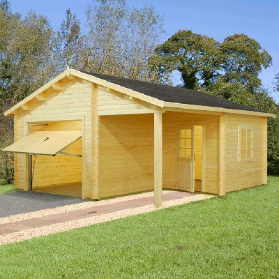 a log cabin garage with up and over door