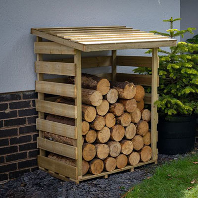 a small, traditional logstore with a pent roof and slatted sides