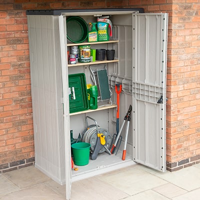 a tall, plastic garden tool shed with open double doors