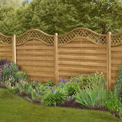 decorative fencing with a scalloped top trellis section