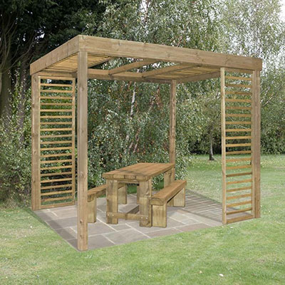 A wooden pergola, with slatted panels, above a wooden table and benches