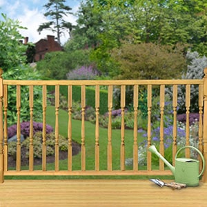 A wooden deck railing kit with turned Edwardian spindles.