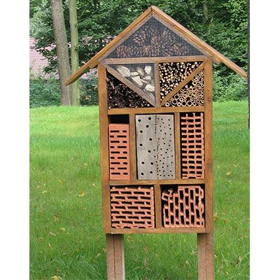 A bug hotel with legs and an apex roof